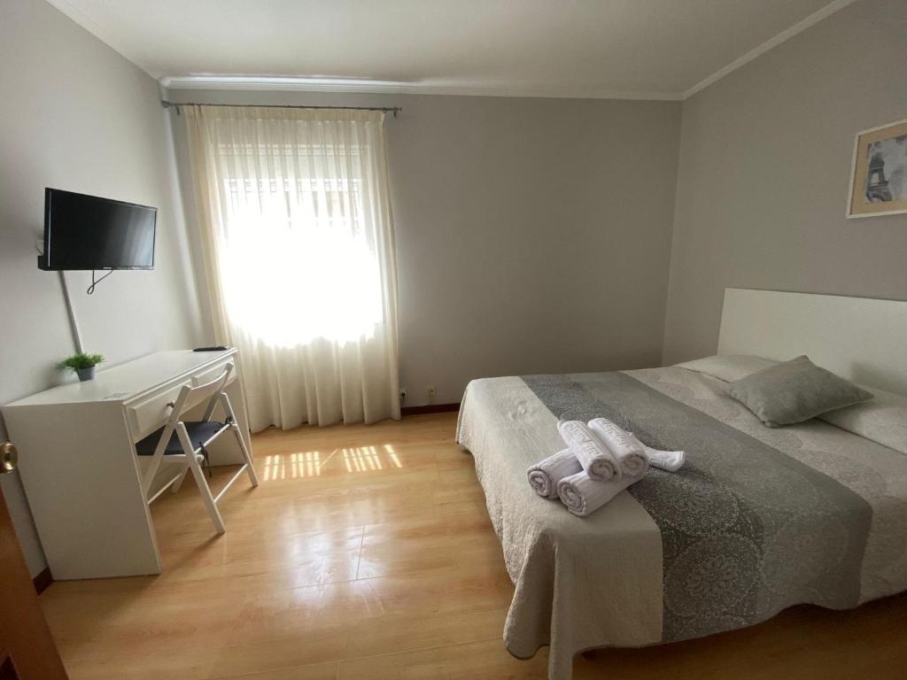 Posteľ alebo postele v izbe v ubytovaní Hotel Cais