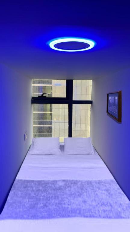 Postel nebo postele na pokoji v ubytování Urban Luxe Capsules