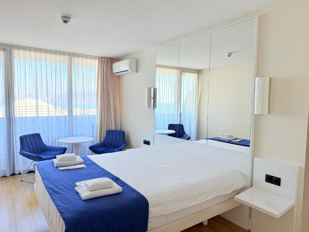 Ένα ή περισσότερα κρεβάτια σε δωμάτιο στο ORBI CITY ApartHotel
