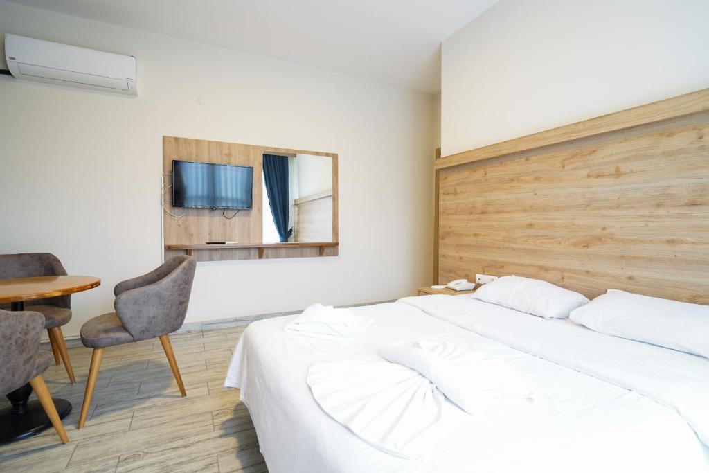 Postel nebo postele na pokoji v ubytování Askoroz Otel İzmit