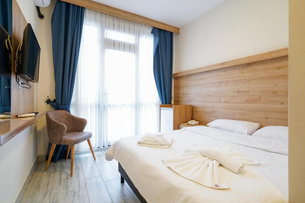 Postel nebo postele na pokoji v ubytování Askoroz Otel İzmit