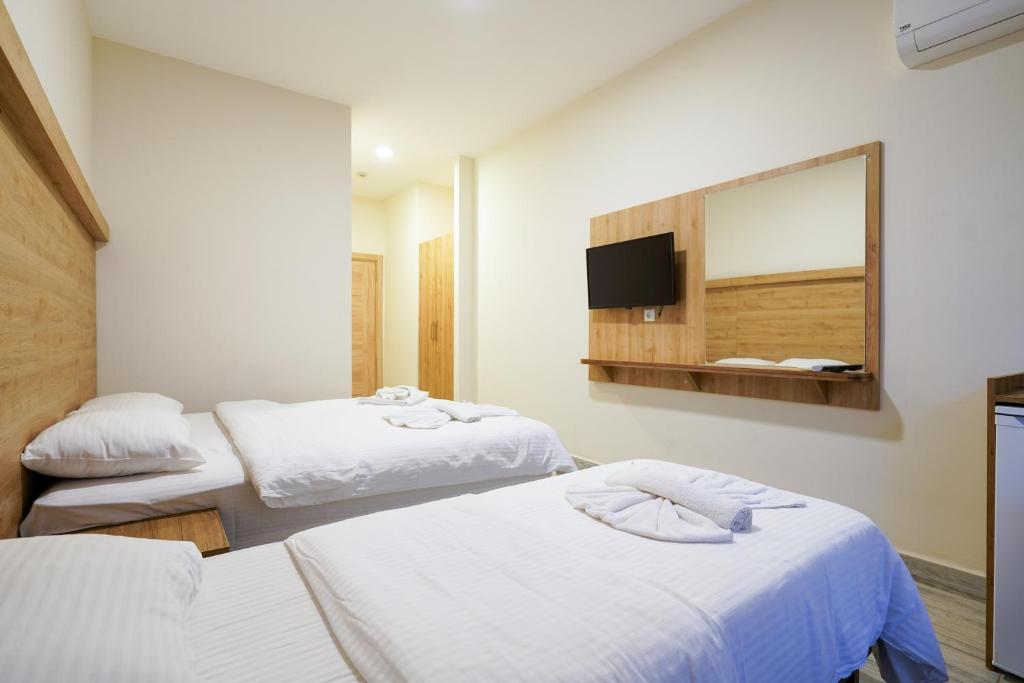 Postel nebo postele na pokoji v ubytování Askoroz Otel İzmit