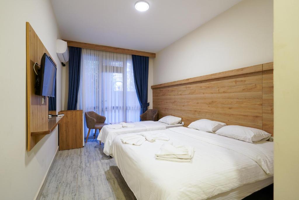 Postel nebo postele na pokoji v ubytování Askoroz Otel İzmit