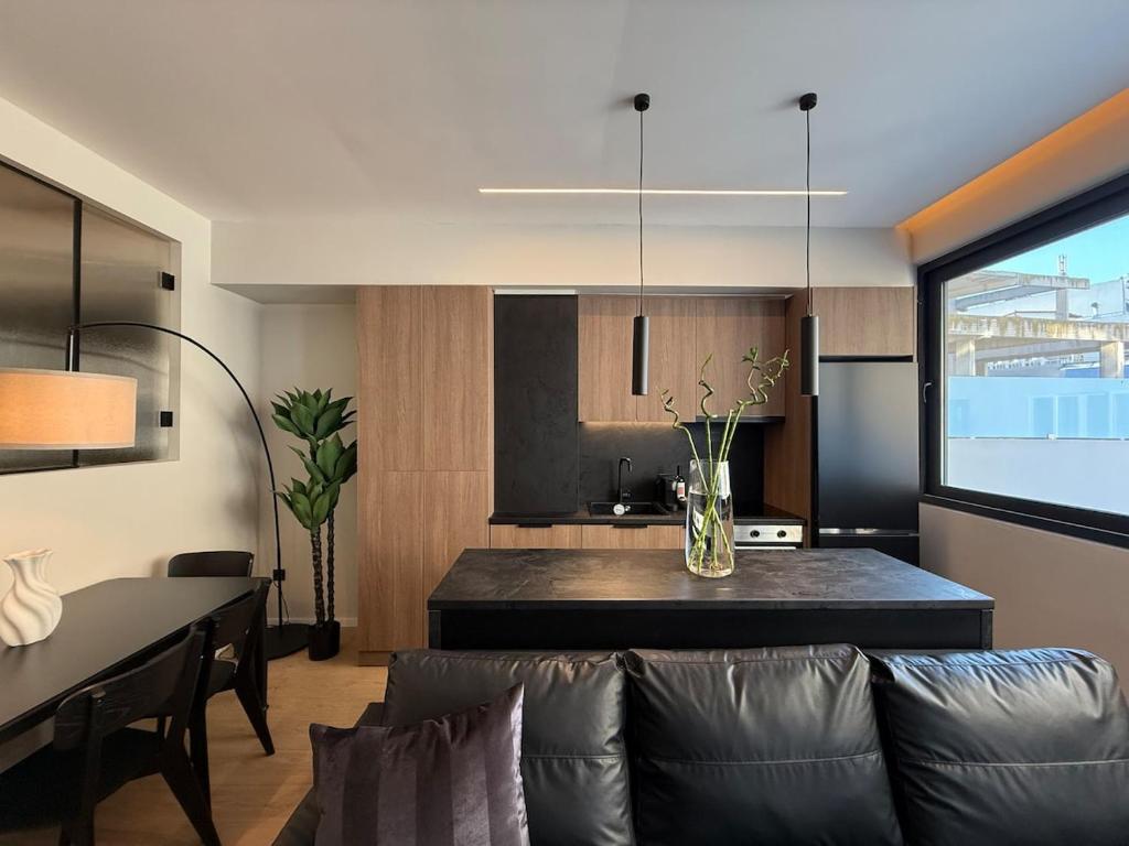 a living room with a couch and a table at DoorMat #31 Juliet in Thessaloniki