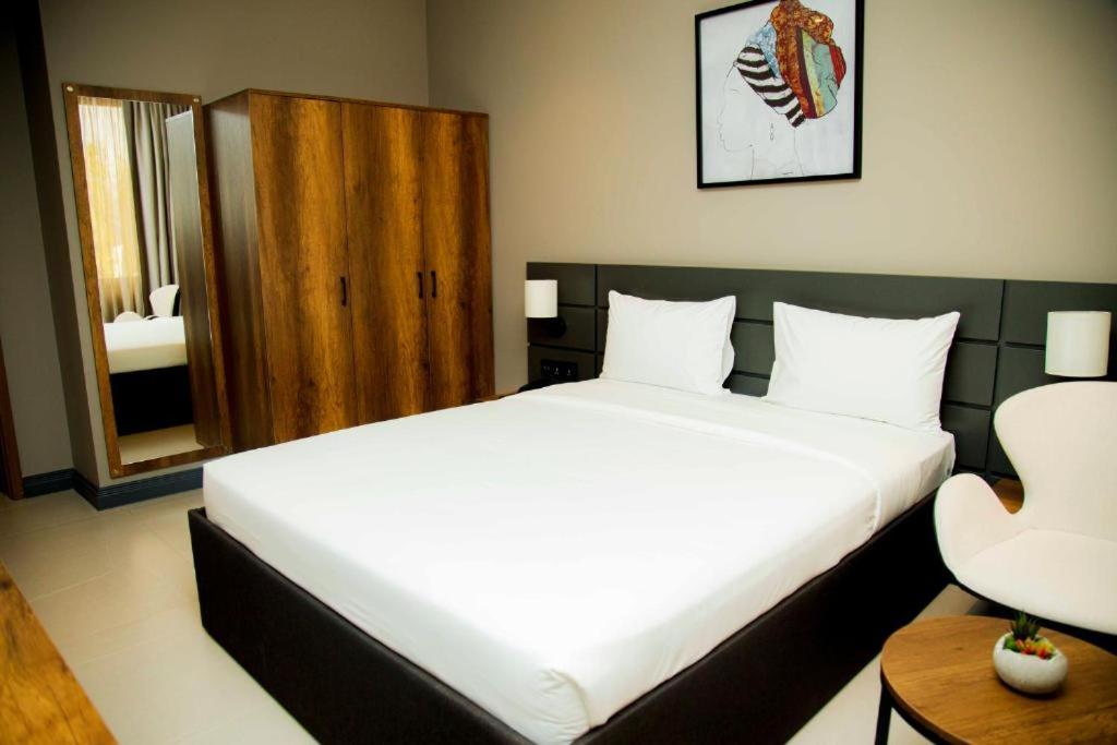 Postel nebo postele na pokoji v ubytování New Amaan Hotel