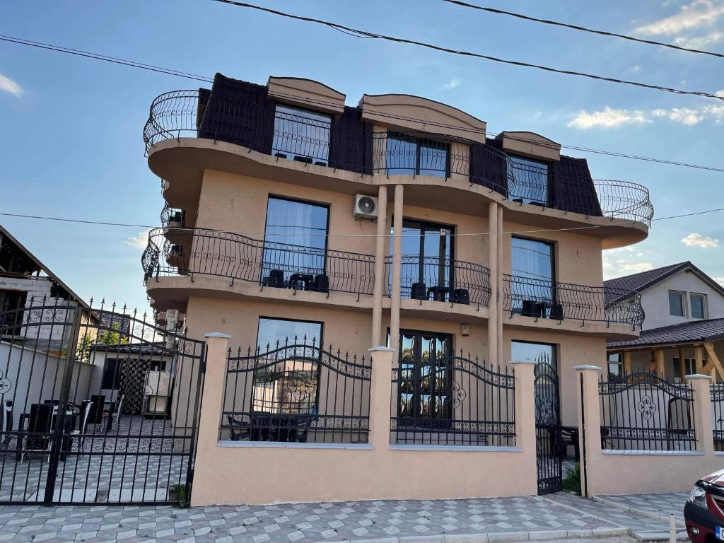 a building with balconies on the side of it at Vila Sephora in Eforie Nord