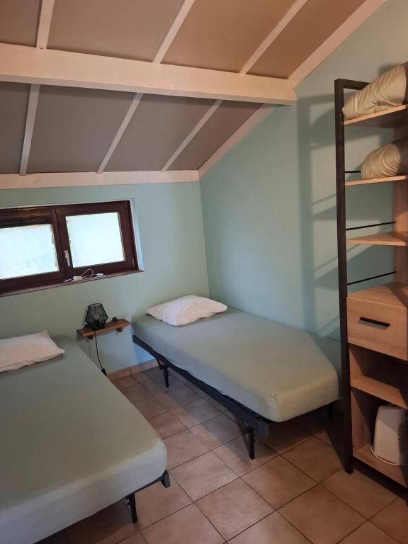 Postel nebo postele na pokoji v ubytování maison de dunes