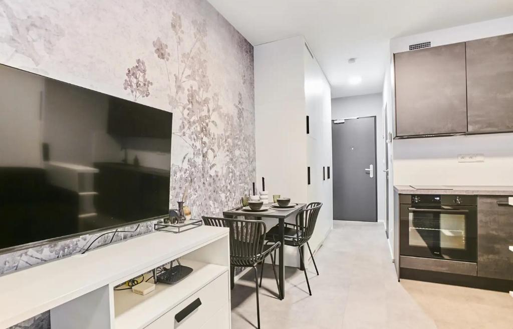 Kuchyň nebo kuchyňský kout v ubytování MyMozart Apartments Prague by Rentero Property