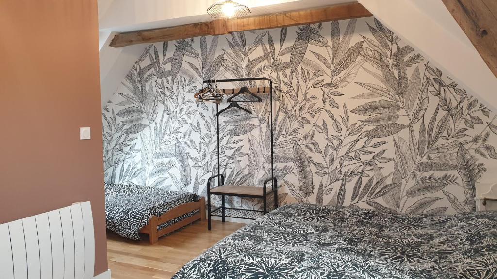 Posteľ alebo postele v izbe v ubytovaní Gîte une histoire de village