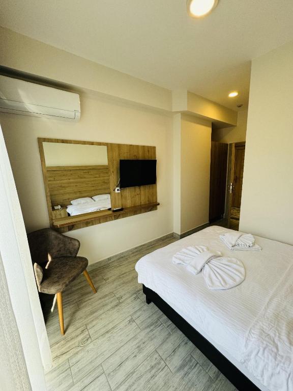 Postel nebo postele na pokoji v ubytování Askoroz Otel İzmit