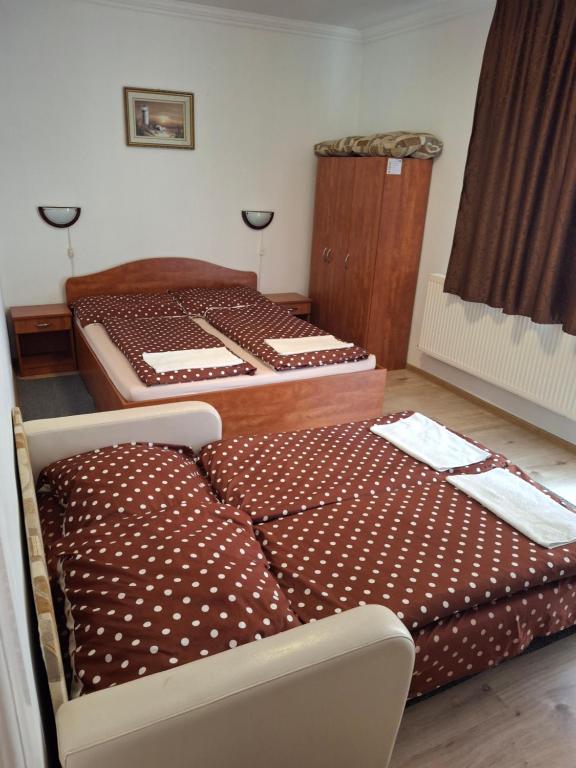 Postel nebo postele na pokoji v ubytování Birta Apartman