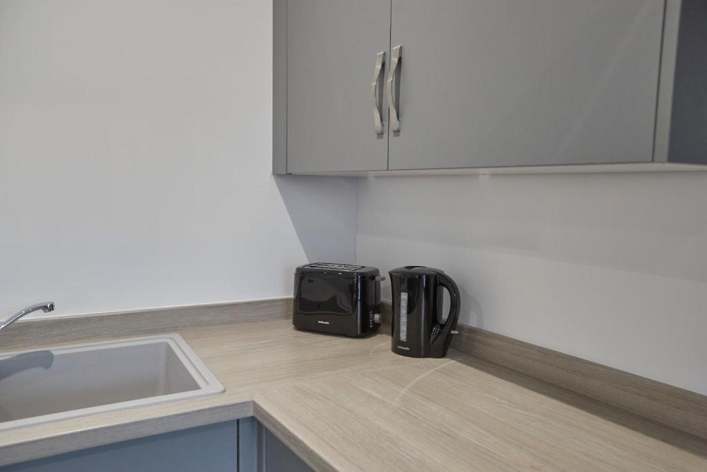 Kuchyň nebo kuchyňský kout v ubytování Zetland House Apartment 5 Loftus