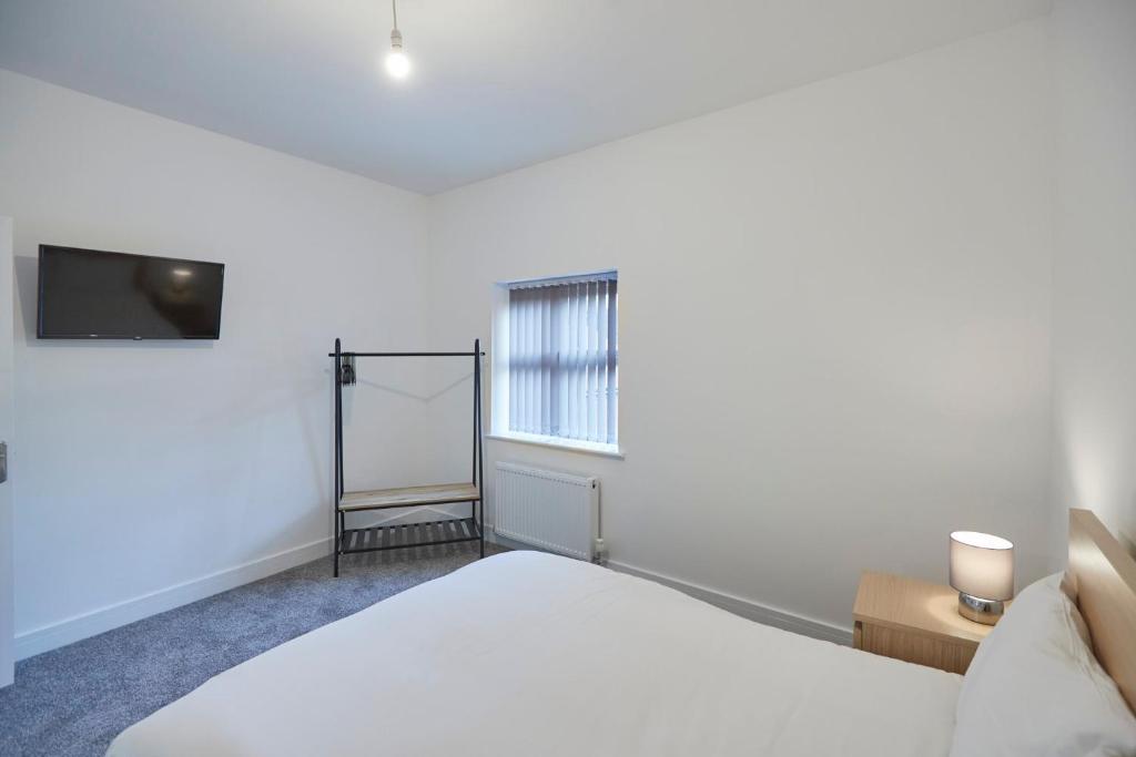 Postel nebo postele na pokoji v ubytování Zetland House Apartment 5 Loftus