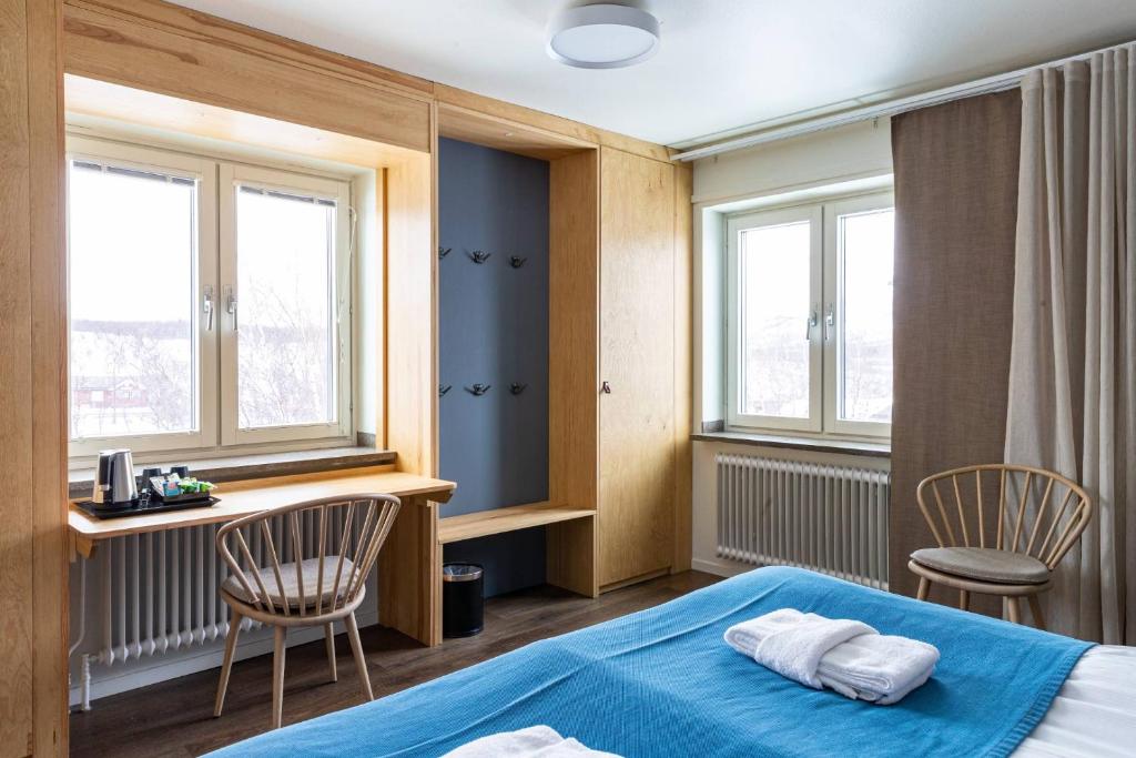 Postel nebo postele na pokoji v ubytování STF Abisko Turiststation