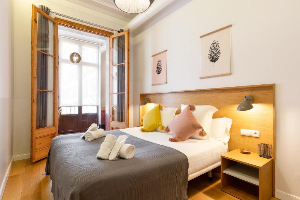 Postel nebo postele na pokoji v ubytování Central Apartments Barcelona
