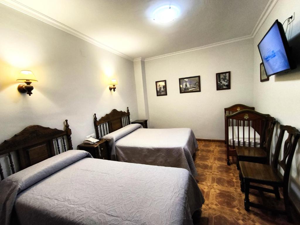 Postel nebo postele na pokoji v ubytování Hostal Bellido