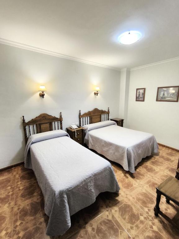 Postel nebo postele na pokoji v ubytování Hostal Bellido
