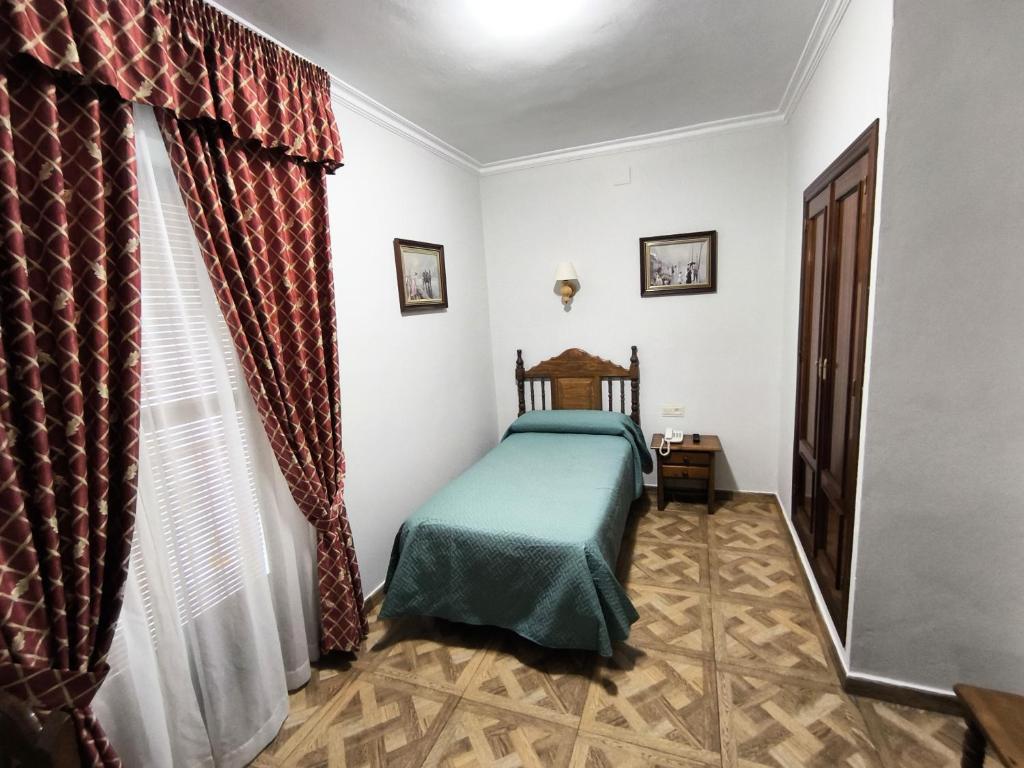 Postel nebo postele na pokoji v ubytování Hostal Bellido