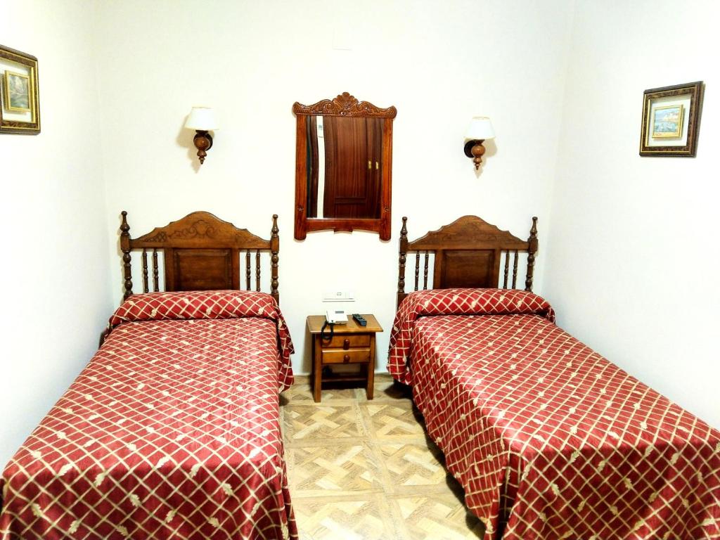 Postel nebo postele na pokoji v ubytování Hostal Bellido
