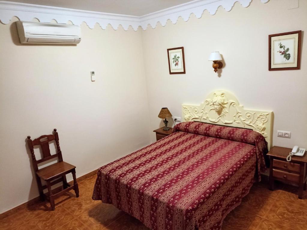 Postel nebo postele na pokoji v ubytování Hostal Bellido