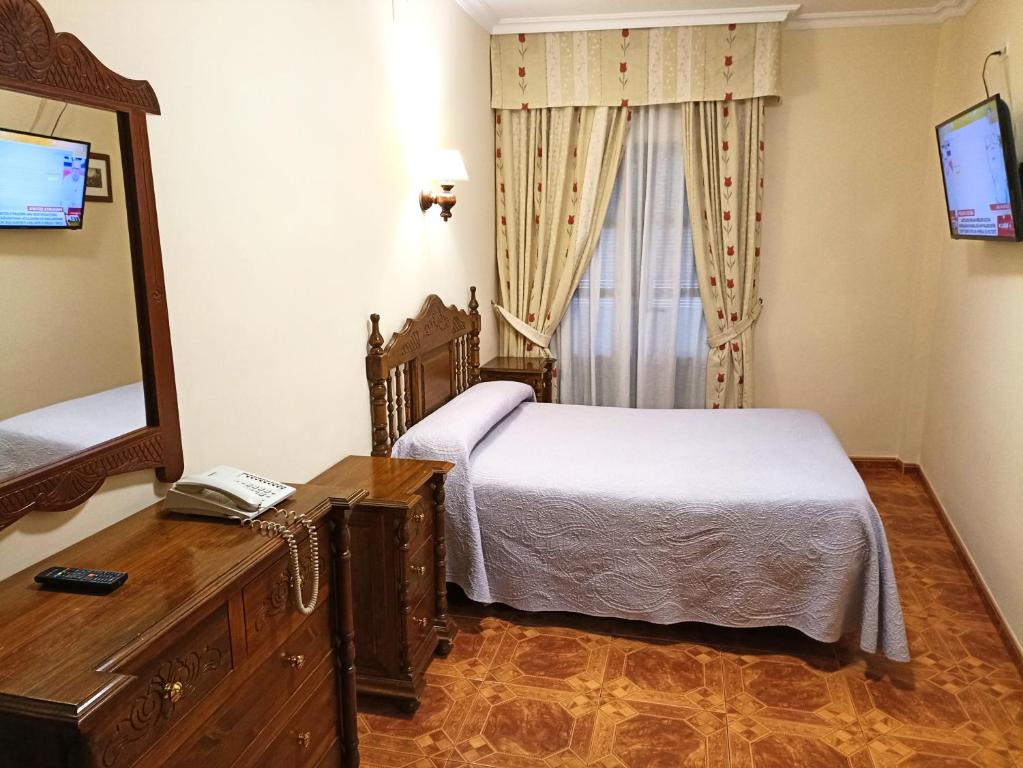 TV a/nebo společenská místnost v ubytování Hostal Bellido
