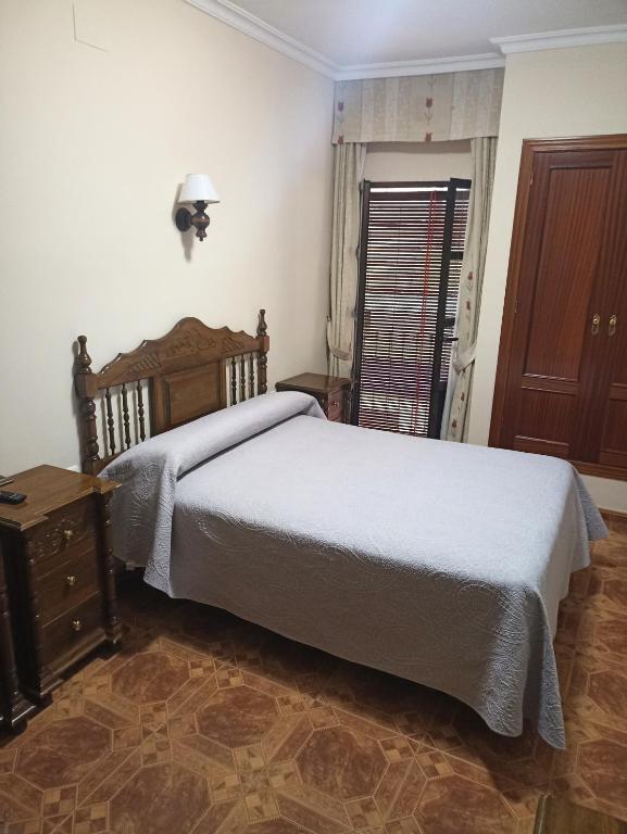 Postel nebo postele na pokoji v ubytování Hostal Bellido
