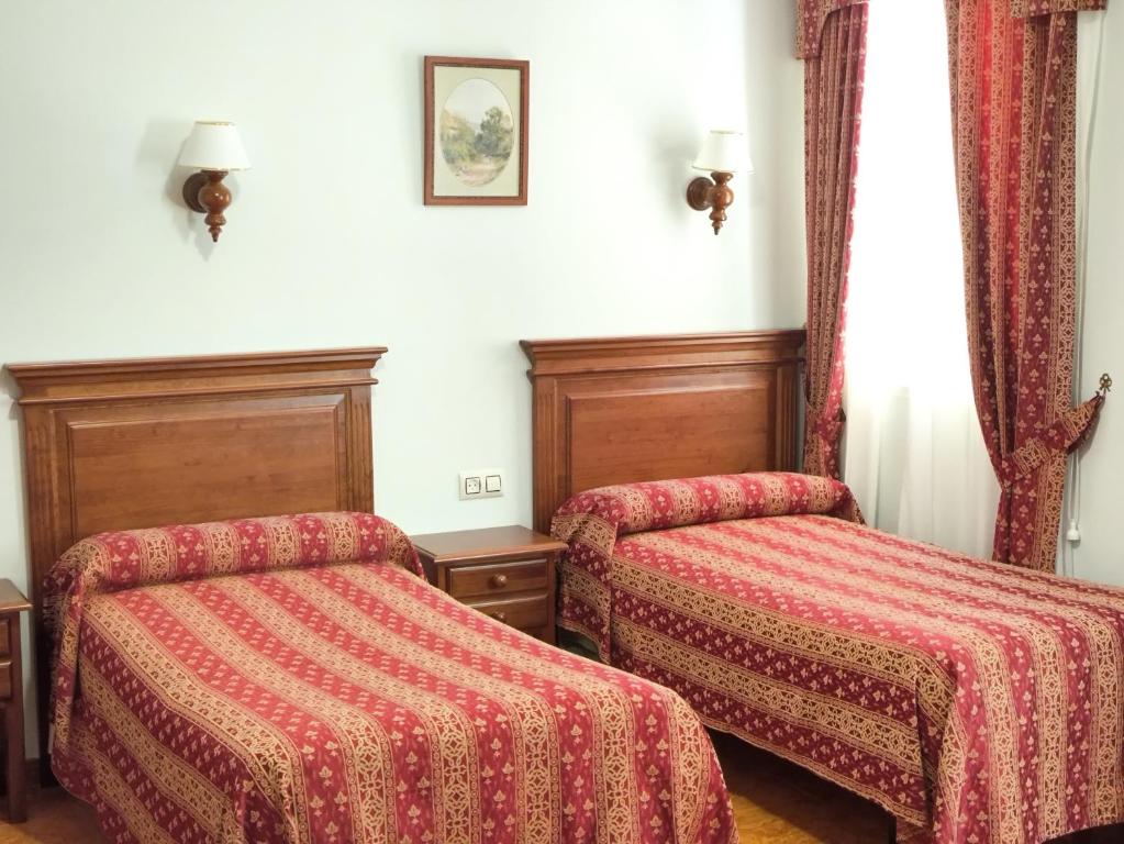 Postel nebo postele na pokoji v ubytování Hostal Bellido