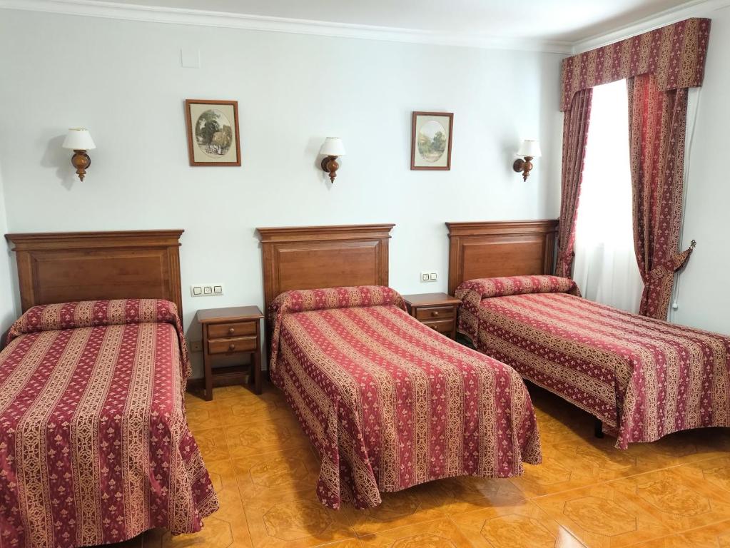 Postel nebo postele na pokoji v ubytování Hostal Bellido