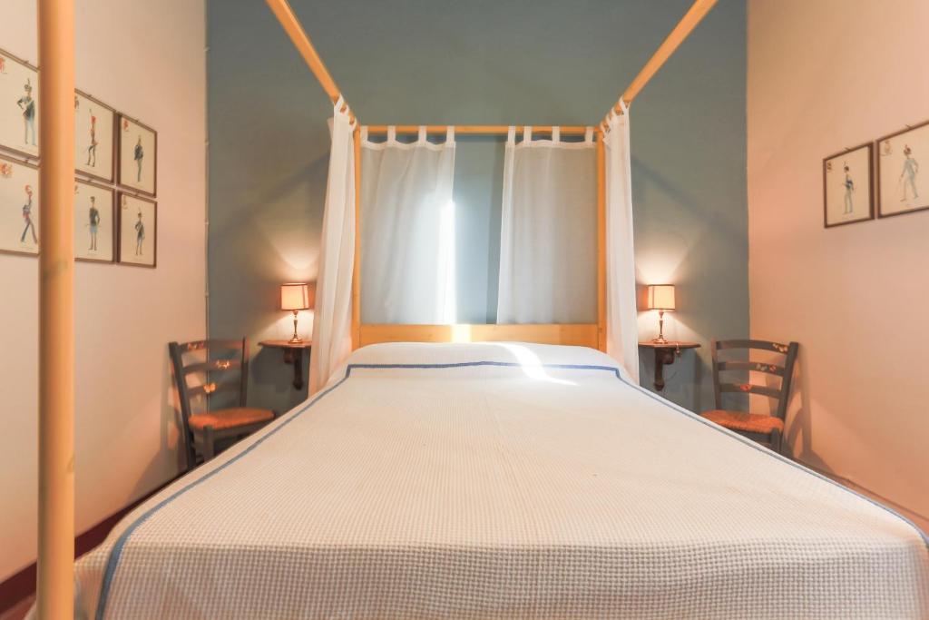 Postel nebo postele na pokoji v ubytování AGRITURISMO LE CORTI DELLA GUALDANA