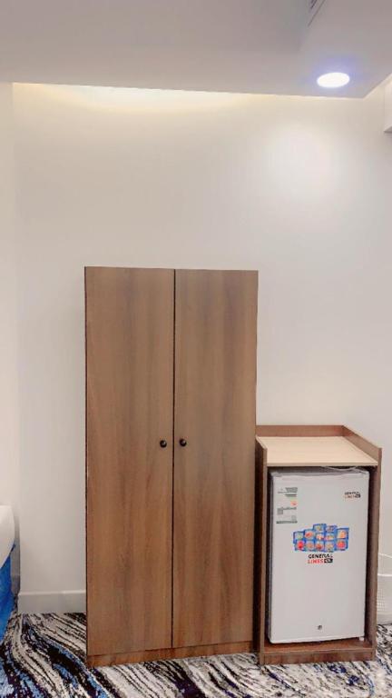 Postel nebo postele na pokoji v ubytování فندق اوتادالمتحدة الذهبي الروضة 4