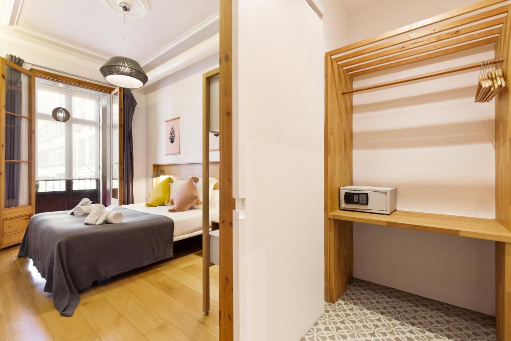 Postel nebo postele na pokoji v ubytování Central Apartments Barcelona