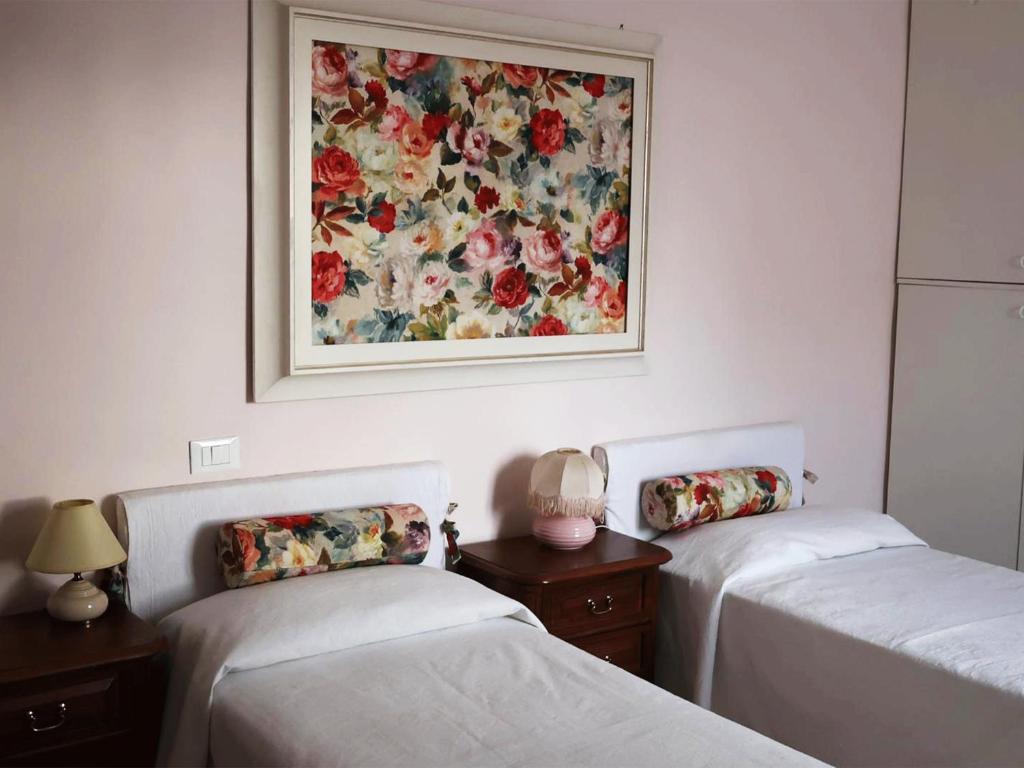 Postel nebo postele na pokoji v ubytování Casa Vacanze L'Acquerello
