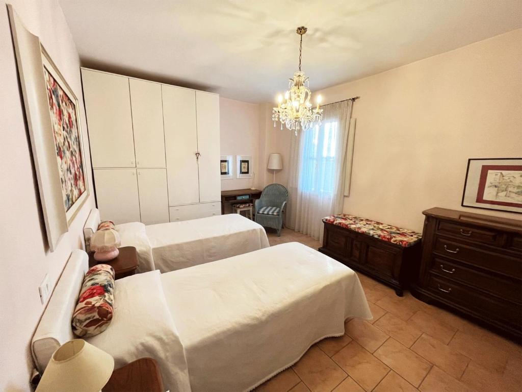 Postel nebo postele na pokoji v ubytování Casa Vacanze L'Acquerello