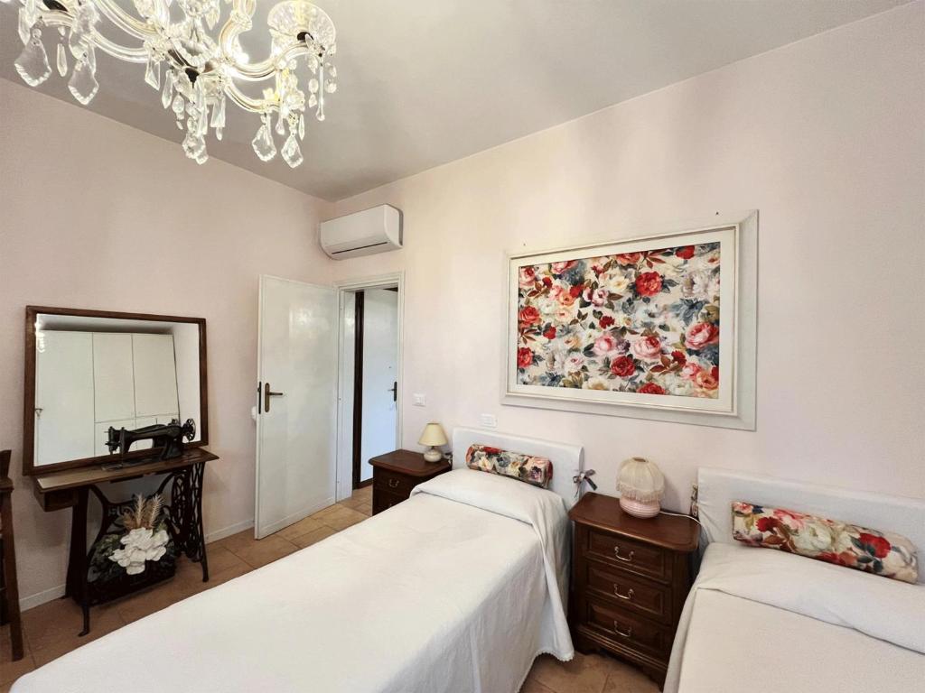 Postel nebo postele na pokoji v ubytování Casa Vacanze L'Acquerello