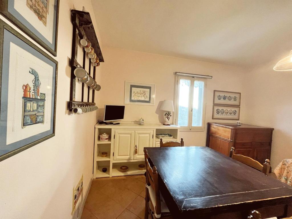 TV a/nebo společenská místnost v ubytování Casa Vacanze L'Acquerello
