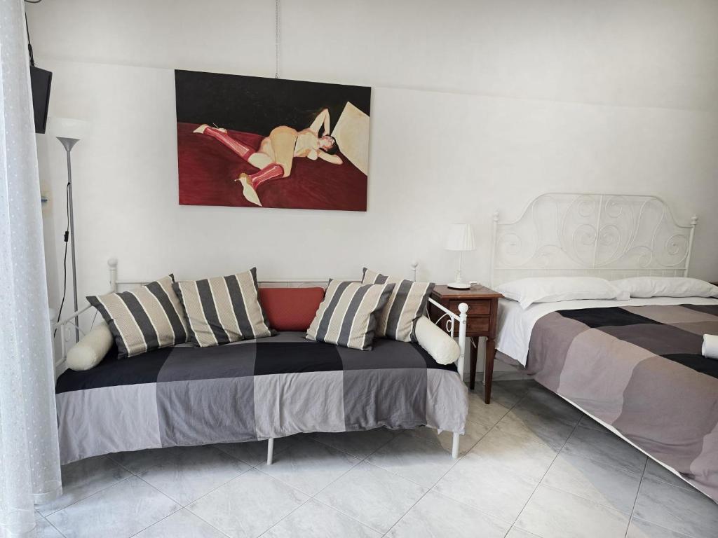 Łóżko lub łóżka w pokoju w obiekcie B&B La Corte
