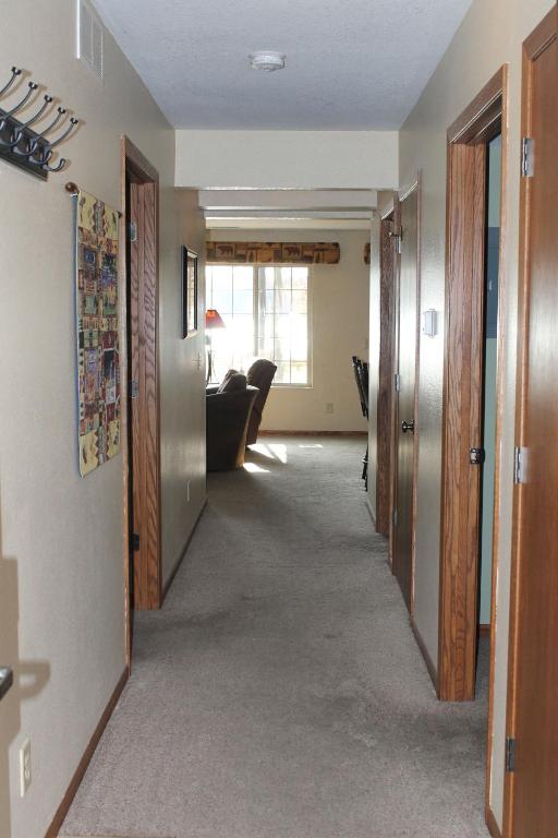 a hallway leading to a living room with a couch at 2 Bedroom Condo Duck Lake in Eagle River