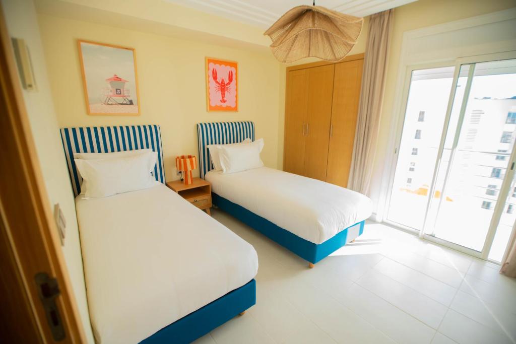 Postel nebo postele na pokoji v ubytování Noreba Hospitality
