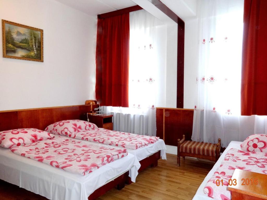 Postel nebo postele na pokoji v ubytování Botax Motel