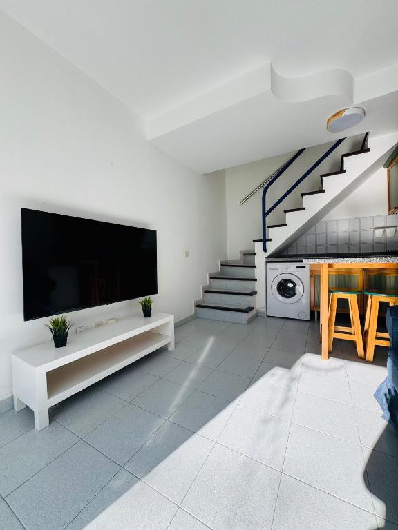 TV a/nebo společenská místnost v ubytování Bungalow Gilly