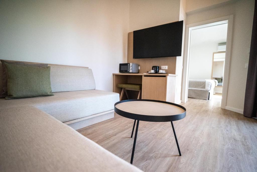 Posteľ alebo postele v izbe v ubytovaní HL Miraflor Suites Hotel