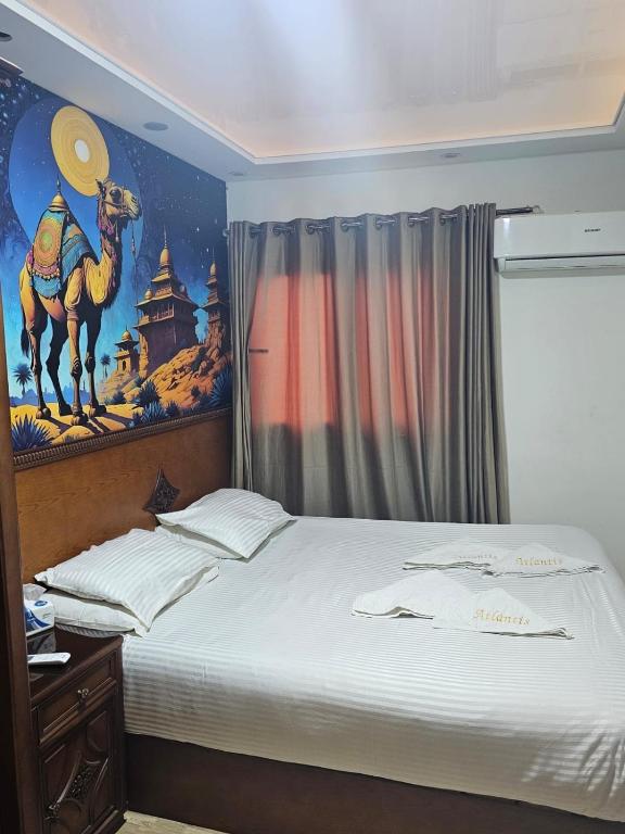 Postel nebo postele na pokoji v ubytování Atlantis Pyramids Inn