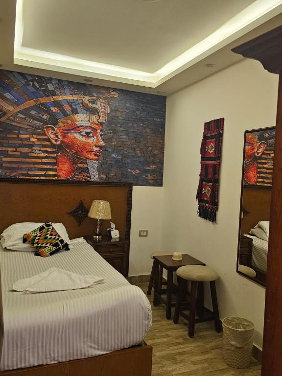 Postel nebo postele na pokoji v ubytování Atlantis Pyramids Inn