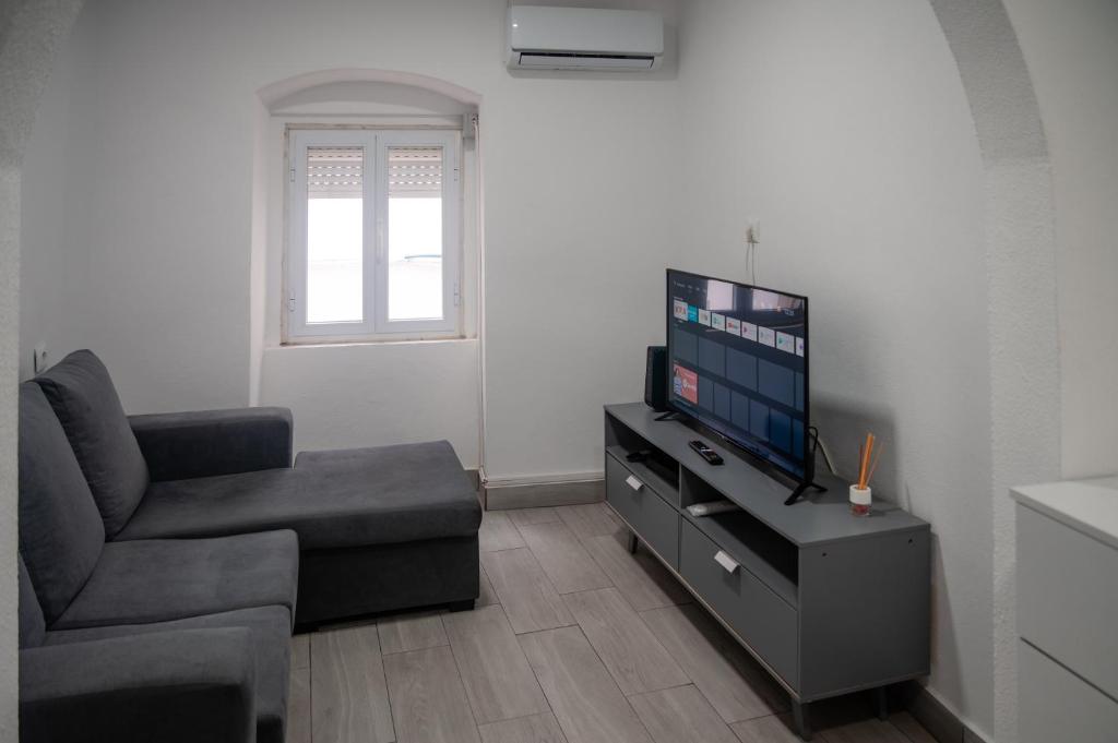 TV a/nebo společenská místnost v ubytování AL-Bash