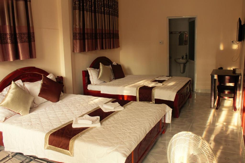 Postel nebo postele na pokoji v ubytování Nui Nho Motel