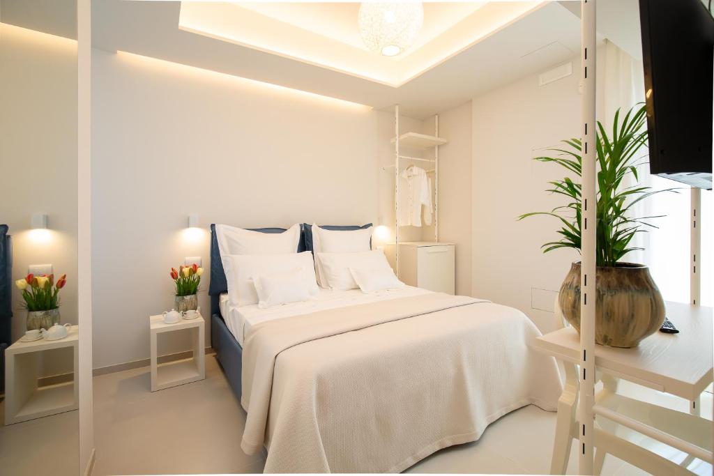 Postel nebo postele na pokoji v ubytování Scirocco Boutique Eco Hotel