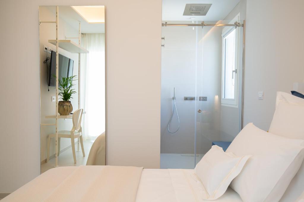 Postel nebo postele na pokoji v ubytování Scirocco Boutique Eco Hotel