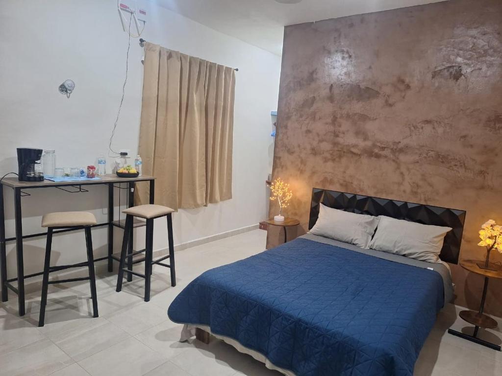 Ένα ή περισσότερα κρεβάτια σε δωμάτιο στο departamentos san juan 2