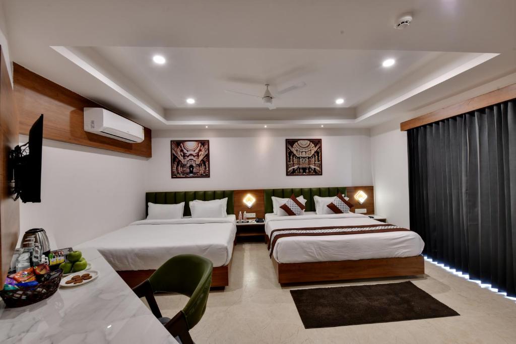 Rúm í herbergi á Soil to Soul Trinity Hotel - A Boutique Stay