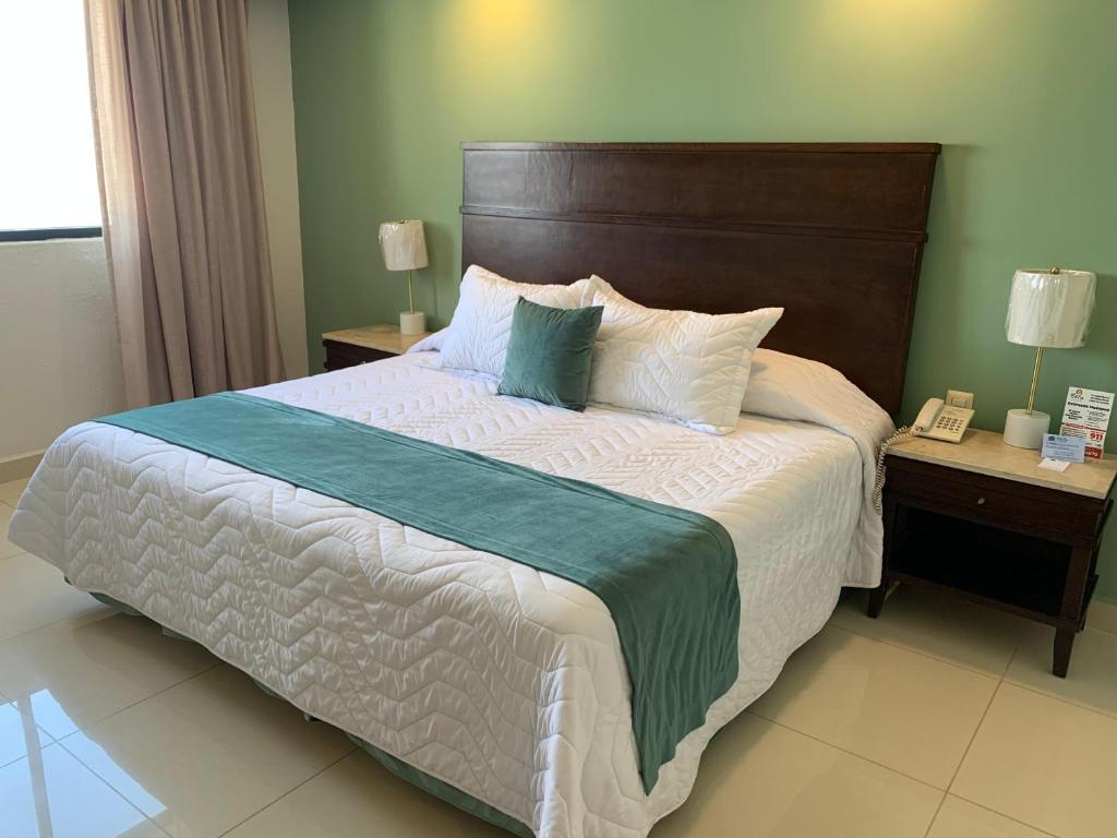Postel nebo postele na pokoji v ubytování Hotel Bello Veracruz
